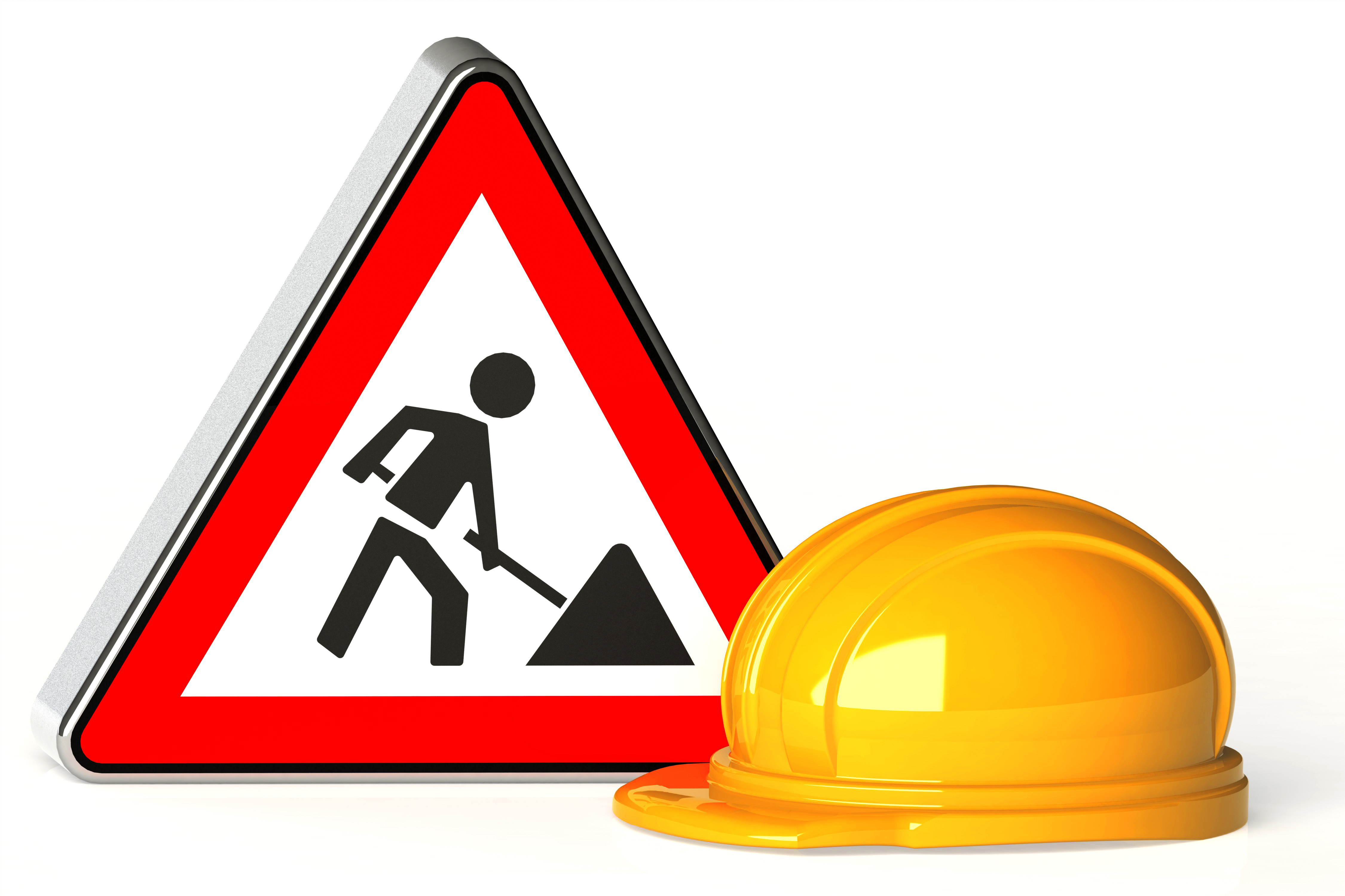 Das Bild zeigt ein dreieckiges Baustellenschild und einen gelben Schutzhelm. Das Schild hat einen roten Rand und ein schwarzes Symbol. Es zeigt eine Person, die mit einer Schaufel arbeitet. Der gelbe Bauhelm liegt schräg vor dem Schild. Der Hintergrund ist weiß und schlicht.